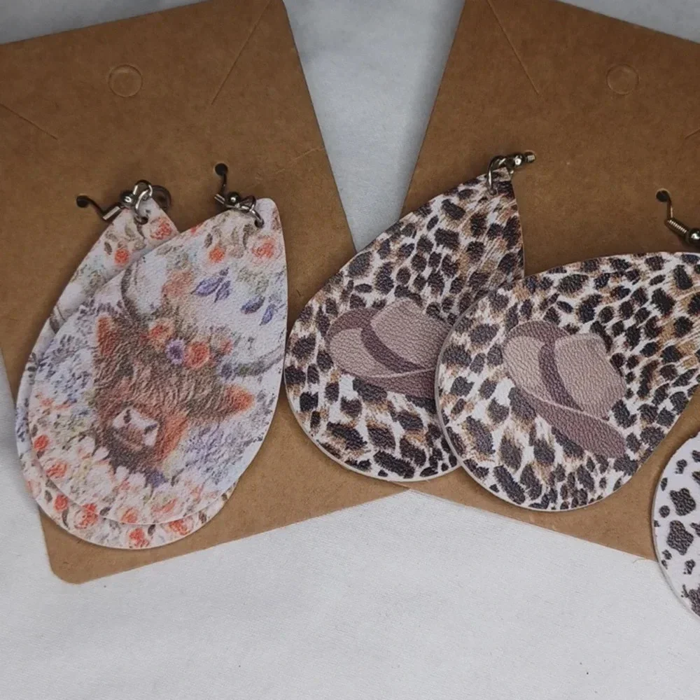 4 pair Cow dangle earrings